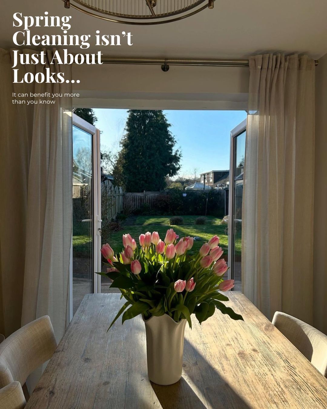 Spring Cleaning - Clean dining room with fresh tulips and open doors to garden